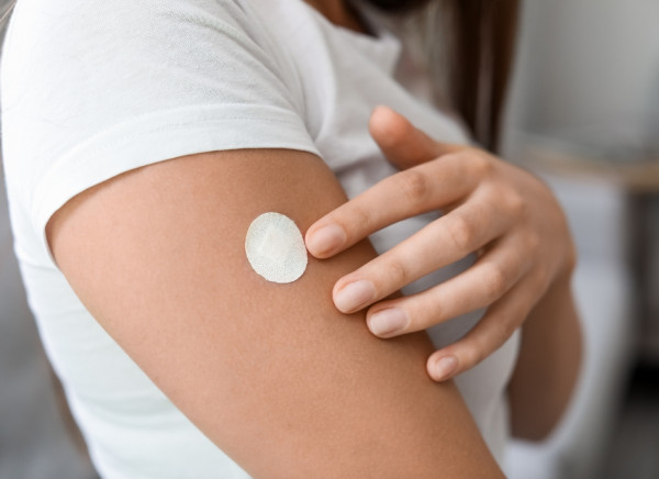 Nicotine patch on woman's arm
