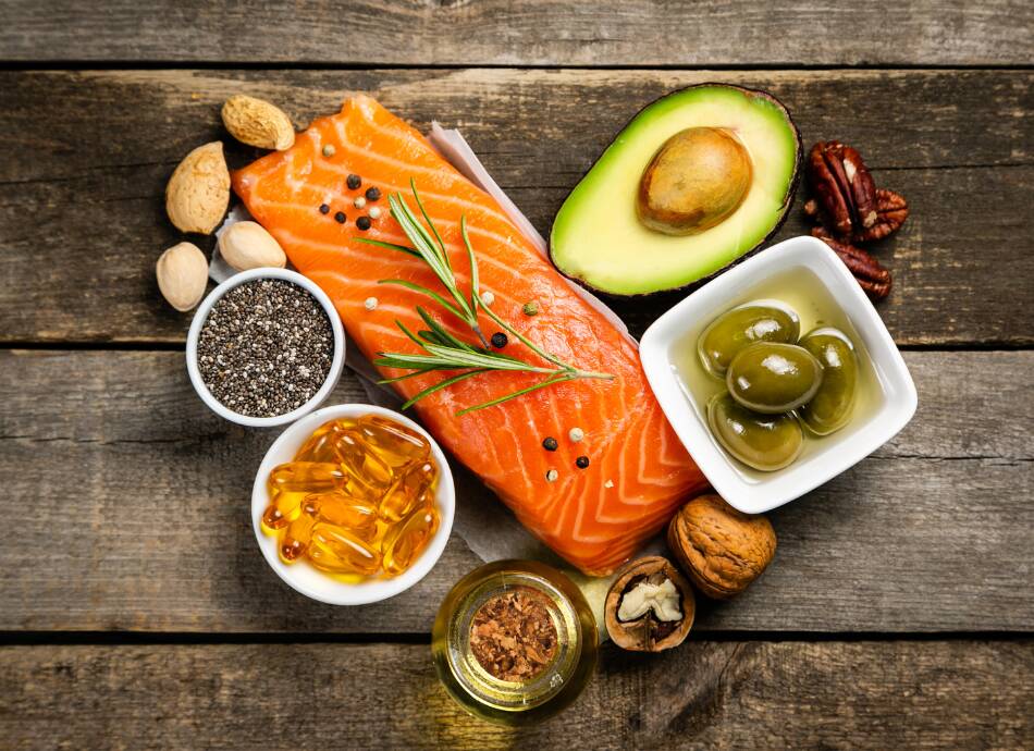 Food with healthy fats on a wooden table